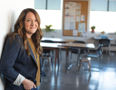 Teacher standing before her classroom